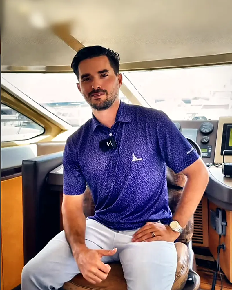 Gabriel Padron, Go Yacht Buddy captain, at the helm of a charter yacht in Miami